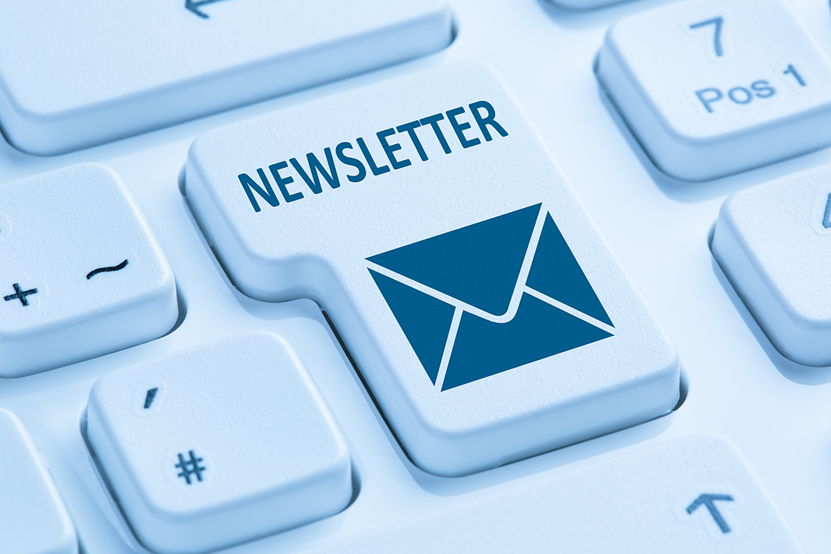 Newsletter and email icon displayed on a computer keyboard